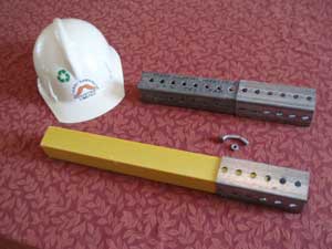 Safe-T-Post (yellow) in existing infrastructure "boot". Steel Telspar behind Safe-T-Post (yellow) in existing infrastructure "boot". Steel Telspar behind